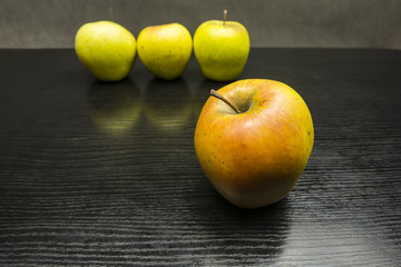 An apple on the table.