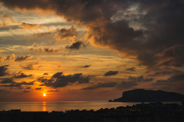 View from balcony of romantic sunset over sea and evening dramatic sky, Alanya, Mediterranean Turkey coast