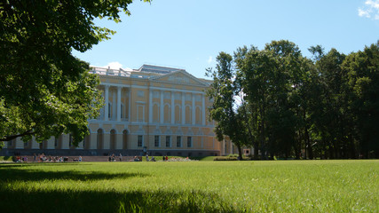 Green field in the Mikhailovsky Garden in the summer day - St. Petersburg, Russia