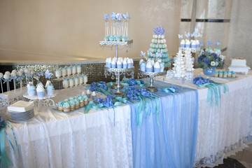 table with cakes and desserts in soft colors