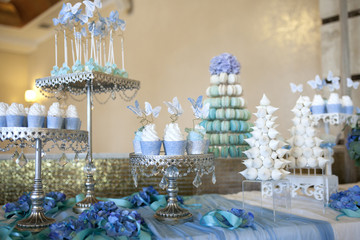 table with cakes and desserts in soft colors
