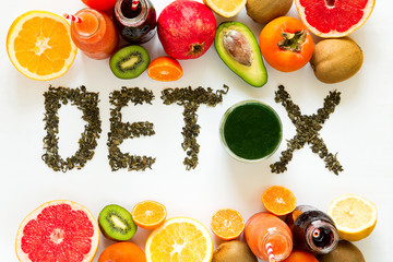 Healthy eating concept. Word 'detox' from green tea with colorful smoothies and fruits. Top view - obrazy, fototapety, plakaty