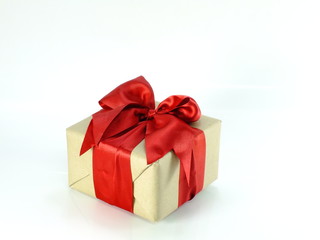 gift box wrapped in recycled paper with ribbon bow isolated on white background