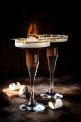 Toasted smores martini with chocolate liquor, cream, marshmallow and graham cracker rim