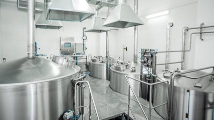 Equipment for the brewery. Large shiny tanks.
