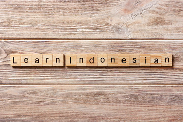 learn indonesian word written on wood block. learn indonesian text on table, concept