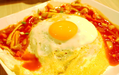 Fried Egg on rice with thai sauce,Sunny side up