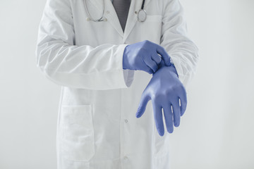 Doctor Putting Gloves On