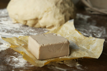 Fresh yeast block for baking. Preparation process of making dough.