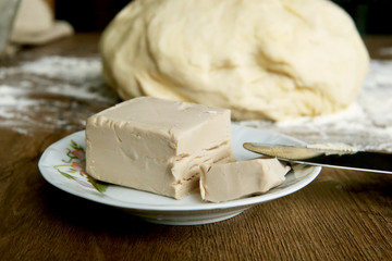 Fresh yeast block for baking. Preparation process of making dough.