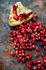 Healthy food background - pomegranate fruit and seeds.