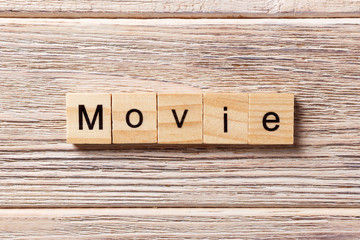 movie word written on wood block. movie text on table, concept