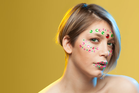 young woman with holiday makeup on her face