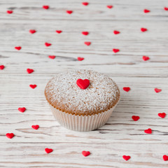Muffin decorated with red hearts