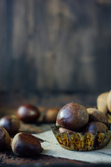 Chestnuts over rustic background