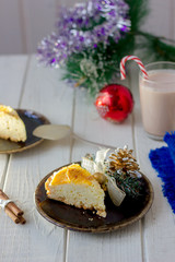 Piece of christmas cake ready to eat on rustic plate.