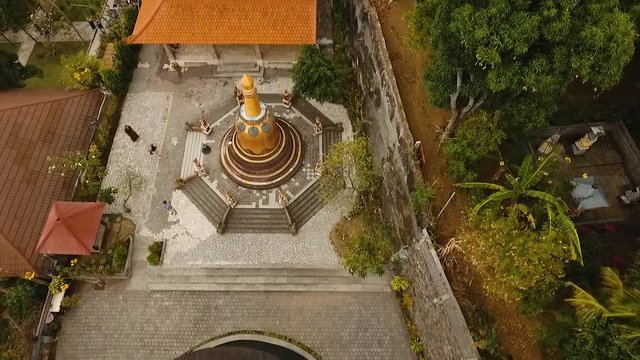 Aerial view of Traditional Buddhist temple Brahma Vihara Arama, Bali,Indonesia. Balinese Temple, Architecture, Ancient design. Travel concept. Aerial footage.