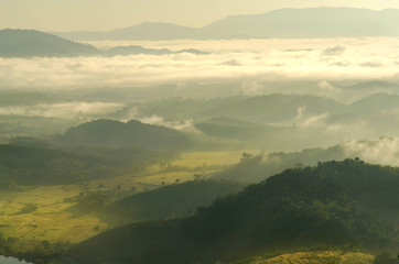 Obraz premium Landscape of mountain with the clouds and fog, Top view of the haze on the mountain, The foggy morning at the mountain.