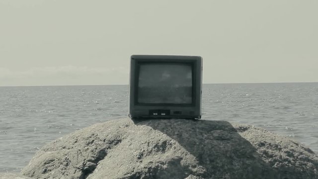 Telly on stone of sea. Paradox, joke
