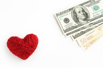 Heart and money on a white background