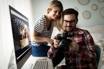 Young attractive designers working together from home