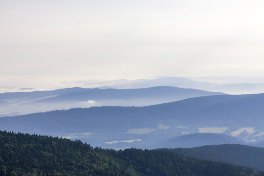 Morning landscape in haze in National park Bayerische Wald,
 view from the mountain Grosser Arber, Germany.