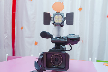 Professional video camera isolated. Professional full HD camcorder