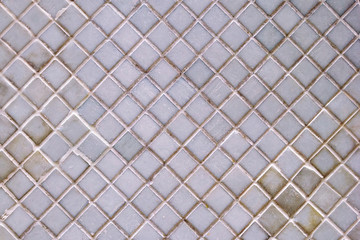 A wall from ceramic pieces white color for background.