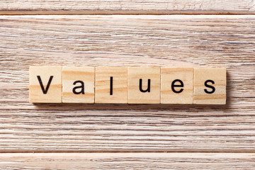 values word written on wood block. values text on table, concept