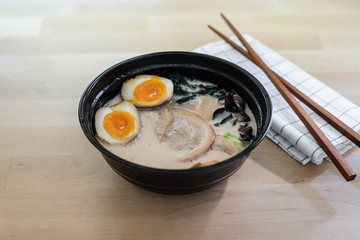 Traditional Japanese soup ramen with sliced pork and eggs