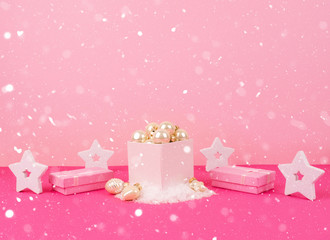 Christmas tree balls on a pink background