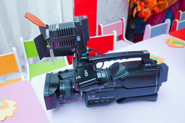 Professional video camera isolated. Professional full HD camcorder