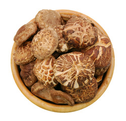Dried Shiitake Mushrooms in bowl isolated on white