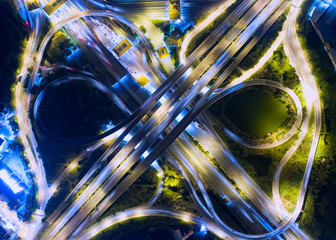 Aerial view Road roundabout, Expressway with car lots in the city in Thailand.beautiful Street , downtown,cityscape,Top view. Background,Aerial view city scape