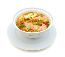 Asian noodle soup in front of white background