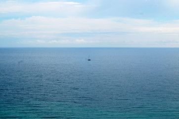 Fototapeta premium small boat in the big sea