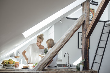Mother and Daughter Having Breakfast