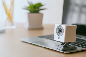 Security camera on Wood table. IP Camera.