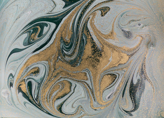 Marble abstract acrylic background. Nature green marbling artwork texture. Golden glitter.