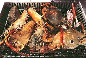 Mixed grilled seafood with mantis shrimp crab squid and shimp