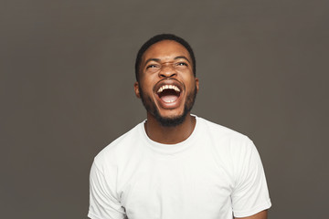 Facial expression, emotions, friendly black man laughing