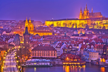 Beautiful scenery of evening Prague. Top view on the Charles Bridge, the Vltava River and the...