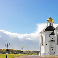 Church in the park. Beautiful church on a sky background. Autumn