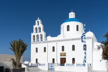 Naklejka premium White blue orthodox church of Panagia Platsani, in the village of Oia. Santorini
