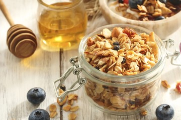 Homemade  Honey Granola in a glass jar, selective focus