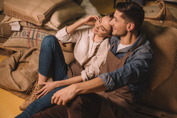 Fototapeta premium selective focus of young couple of coffee shop owners having break during work