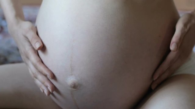 Big belly of a pregnant woman