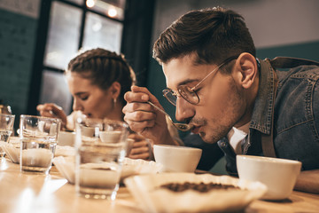 coffee shop workers checking coffee quality during coffee food function