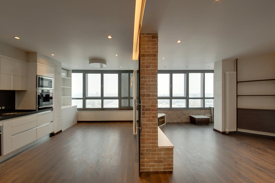 The Room Divided Into Two Parts, A Drawing Room And Kitchen With A Dark Parquet