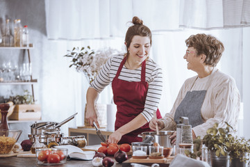 Women in kitchen aprons